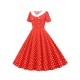 Weinlese-Kleid der 1950er Jahre mit V-Ausschnitt Plissee Layered kurzen Ärmeln Frau knielangen Tupfen-Swing-Kleid
